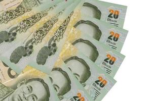 20 Thai Baht bills lies isolated on white background with copy space stacked in fan shape close up photo