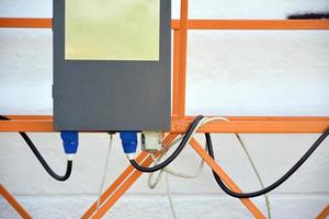 sistema de control eléctrico de plataforma suspendida de cable para trabajos de fachada en edificios altos de varios pisos. el sistema de control eléctrico es un dispositivo de manejo foto