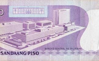 Philippines central bank on 100 piso Philippines money bill close up fragment photo