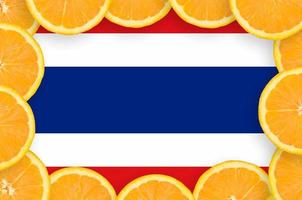 Thailand flag  in fresh citrus fruit slices frame photo