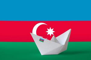 Azerbaijan flag depicted on paper origami ship closeup. Handmade arts concept photo