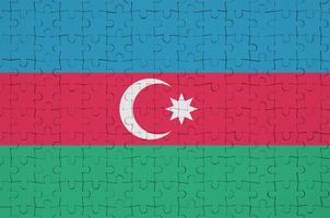 Azerbaijan flag  is depicted on a folded puzzle photo