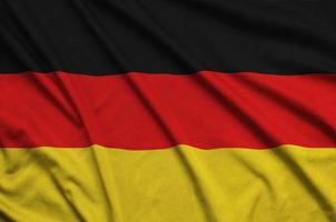 Germany flag  is depicted on a sports cloth fabric with many folds. Sport team banner photo