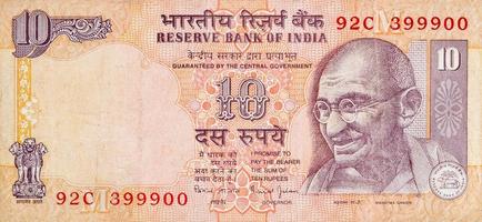 cara de mahatma gandhi en el billete de banco indio diez rupias. 10 rupias moneda nacional de la india foto