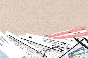 USCIS form I-131 Application for travel document lies on flat lay office table and ready to fill. U.S. Citizenship and Immigration services paperwork concept photo