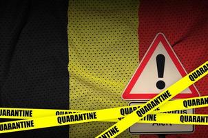 Belgium flag and Covid-19 quarantine yellow tape. Coronavirus or 2019-nCov virus photo