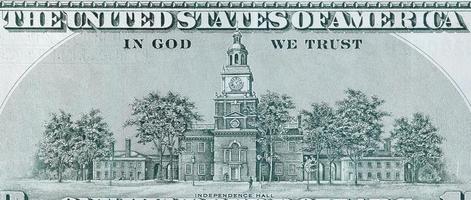 Independence Hall on 100 dollars banknote back side closeup macro fragment. United states hundred dollars money bill photo