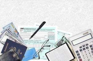 IRS form 1040 U.S. Individual income tax return with refund check lies on flat lay office table and ready to fill. U.S. Internal revenue services paperwork concept photo