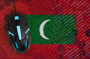 Maldives flag  and computer mouse. Digital threat, illegal actions on the Internet photo