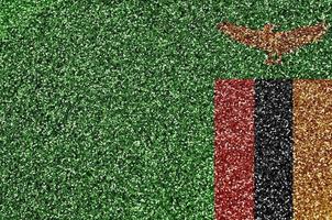 Zambia flag depicted on many small shiny sequins. Colorful festival background for party photo