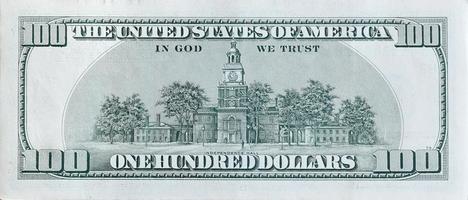 Independence Hall on 100 dollars banknote back side closeup macro fragment. United states hundred dollars money bill photo