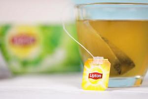 KHARKOV, UKRAINE - DECEMBER 8, 2020 Lipton classic green tea bags. Lipton is a British brand of tea owned by Unilever and PepsiCo photo