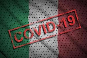 Italy flag and red Covid-19 stamp. Coronavirus 2019-nCov outbreak photo