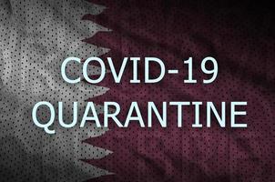 Qatar flag and Covid-19 quarantine inscription. Coronavirus or 2019-nCov virus photo