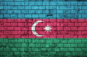 Azerbaijan flag is painted onto an old brick wall photo