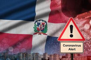 Dominican Republic flag and Coronavirus 2019-nCoV alert sign. Concept of high probability of novel coronavirus outbreak through traveling tourists photo