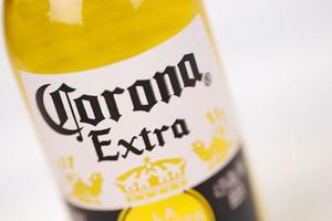 KHARKOV, UKRAINE - DECEMBER 9, 2020 Bottle of Corona Extra Beer. Corona produced by Grupo Modelo with Anheuser Busch InBev most popular imported beer in the US photo