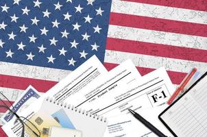 USCIS form I-20 Certificate of eligibility for nonimmigrant student status lies on flat lay office table and ready to fill. U.S. Citizenship and Immigration services paperwork concept photo