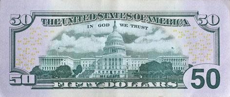 US Capitol on 50 dollars banknote back side closeup macro fragment. United states fifty dollars money bill photo
