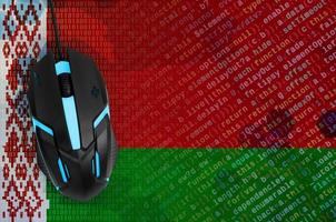Belarus flag  and computer mouse. Digital threat, illegal actions on the Internet photo