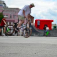 Defocused image of a lot of people with bmx bikes. Meeting of fans of extreme sports photo