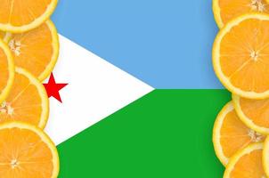 Djibouti flag  in citrus fruit slices vertical frame photo