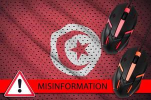 Tunisia flag and two computer mouses. Misinformation during Coronavirus or 2019-nCov virus concept photo