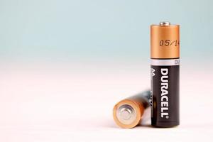 KHARKIV, UKRAINE - MAY 02, 2021 Duracell batteries on white background. Duracell is an American brand of batteries and smart power solutions manufactured by Procter and Gamble photo