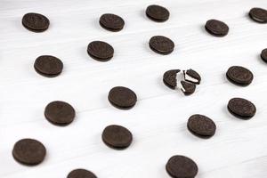 KHARKIV, UKRAINE - MAY 02, 2021 Oreo sandwich cookies on white table. Oreo is a sandwich cookie with a sweet cream is the best selling cookie in the US photo