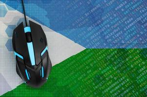 Djibouti flag  and computer mouse. Digital threat, illegal actions on the Internet photo