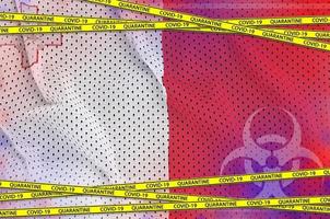 Malta flag and Covid-19 quarantine yellow tape. Coronavirus or 2019-nCov virus concept photo