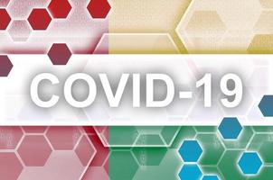 Guinea Bissau flag and futuristic digital abstract composition with Covid-19 inscription. Coronavirus outbreak concept photo