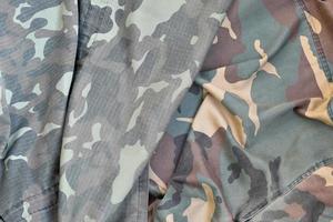 Camouflage background texture as backdrop for army and military design projects photo