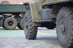 Close up of green military truck. Modern military transportation vehicle technologies photo