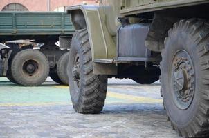 Close up of green military truck. Modern military transportation vehicle technologies photo