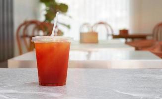 glass of ice tea on cafe table photo