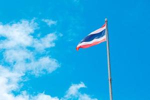 Thai flag waving in the clear sky. photo