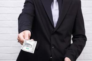 man with a bill in his hands on a white background photo