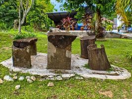 Chairs and tables made of wood pieces in the hospital garden photo