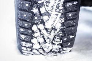 Winter studded tires on snow photo