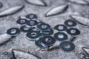 PIle of shiny screw washers. photo