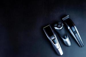 hair clipper black background. photo