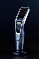 hair clipper black background. photo