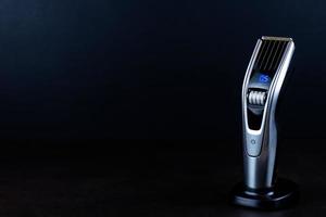 hair clipper black background. photo