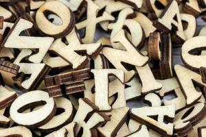 messy alphabet letters made of wood photo