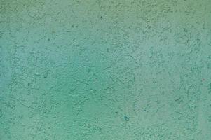 textura de metal de hierro pintado de verde brillante pintura descascarada de la antigua pared de chapa oxidada con corrosión. el fondo foto
