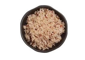 brown rice in a cup on a white background photo