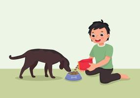 lindo niño alimentando a su mascota con comida animal vector