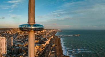 Magical sunset aerial view of British Airways i360 viewing tower pod with tourists in Brighton photo