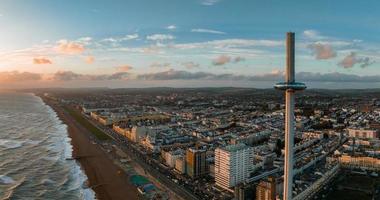 Magical sunset aerial view of British Airways i360 viewing tower pod with tourists in Brighton photo